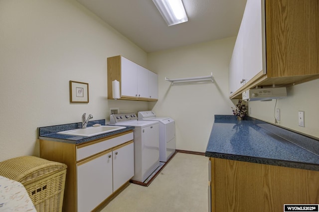 2867 Ardon Ln, Casper, WY 82609 - laundry area featuring cabinet space, light carpet, and washer and clothes dryer