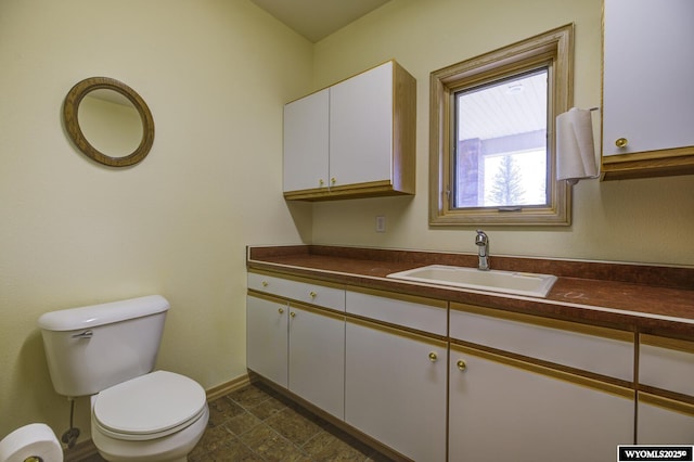 2867 Ardon Ln, Casper, WY 82609 - half bath with toilet, vanity, and baseboards