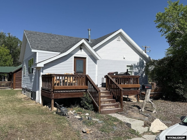 210 N 5th St W, Riverton, WY 82501 - back of house featuring roof with shingles and a wooden deck