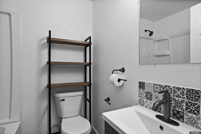 3057 Allendale Blvd, Casper, WY 82601 - bathroom with tasteful backsplash, vanity, and a textured wall