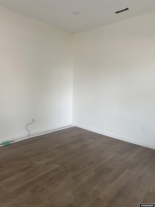409 B St, Rock Springs, WY 82901 - empty room featuring baseboards and dark wood finished floors