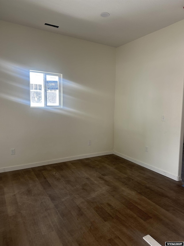 409 B St, Rock Springs, WY 82901 - unfurnished room with dark wood finished floors and baseboards