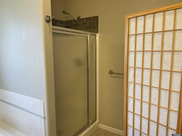 4924 Mountain Way, Casper, WY 82601 - full bath featuring a shower stall, a bath, and tile patterned flooring