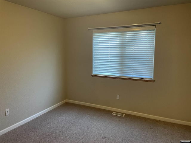 4924 Mountain Way, Casper, WY 82601 - spare room featuring baseboards and carpet floors