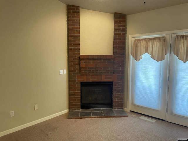 4924 Mountain Way, Casper, WY 82601 - unfurnished living room with carpet floors and a brick fireplace