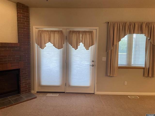 4924 Mountain Way, Casper, WY 82601 - doorway with carpet and a brick fireplace
