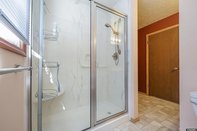1301 Overland Dr, Rock Springs, WY 82901 - bathroom featuring a stall shower and a textured ceiling
