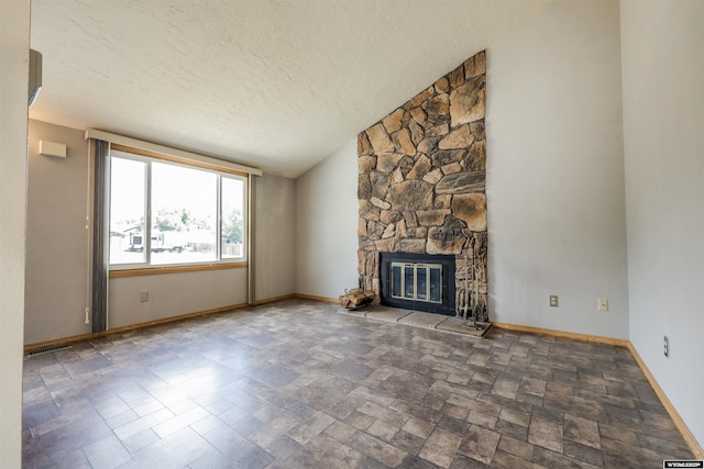 1301 Overland Dr, Rock Springs, WY 82901 - unfurnished living room with a fireplace, a textured ceiling, and stone finish floors