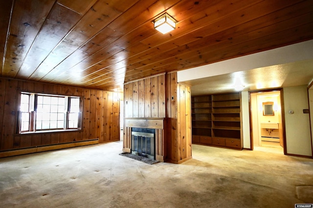 1339 S Mitchell St, Casper, WY 82601 - unfurnished living room featuring a baseboard heating unit, wood walls, a tile fireplace, wood ceiling, and built in features