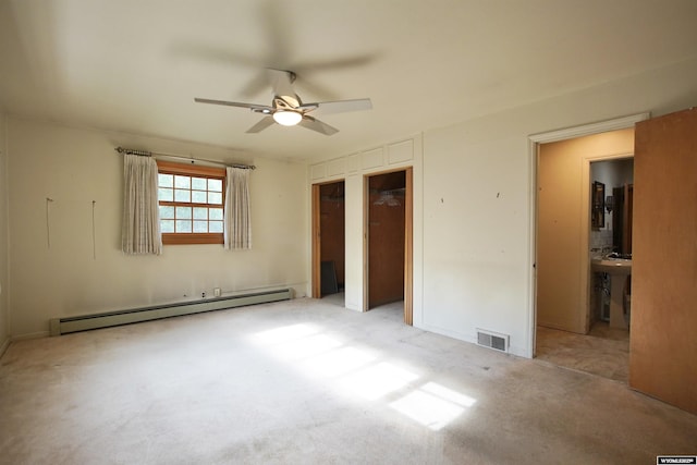1339 S Mitchell St, Casper, WY 82601 - unfurnished bedroom with a baseboard heating unit, carpet floors, and a ceiling fan