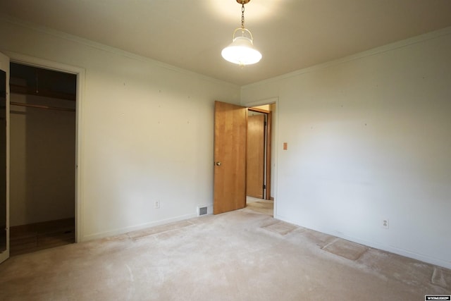 1339 S Mitchell St, Casper, WY 82601 - unfurnished bedroom featuring light carpet, crown molding, and a closet