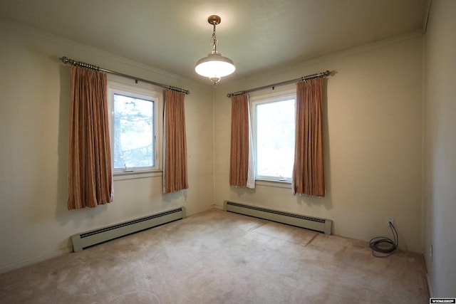 1339 S Mitchell St, Casper, WY 82601 - carpeted empty room with baseboard heating, healthy amount of natural light, and ornamental molding