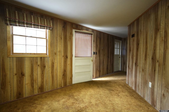 1339 S Mitchell St, Casper, WY 82601 - spare room with carpet floors and wooden walls