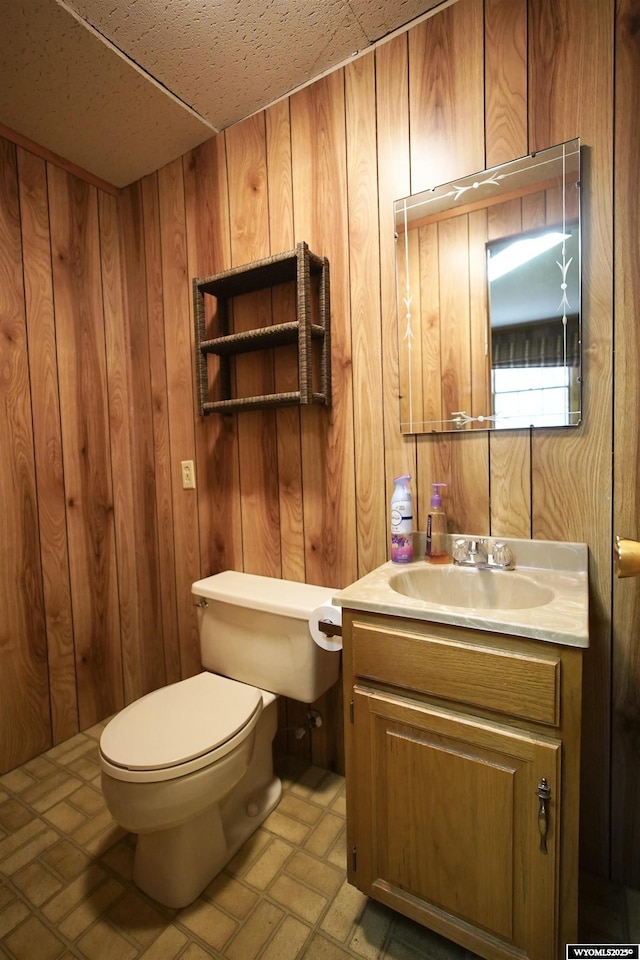 1339 S Mitchell St, Casper, WY 82601 - bathroom with wooden walls and vanity