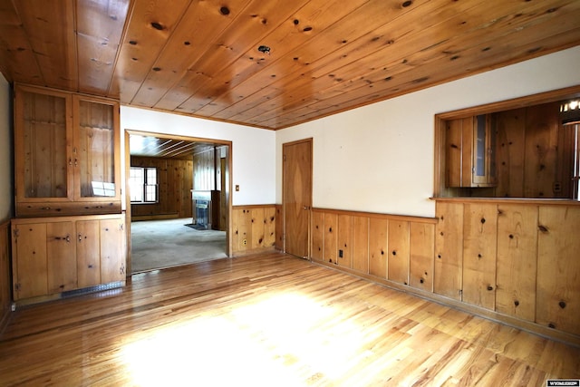 1339 S Mitchell St, Casper, WY 82601 - spare room with light wood finished floors, wooden walls, a wainscoted wall, and wood ceiling