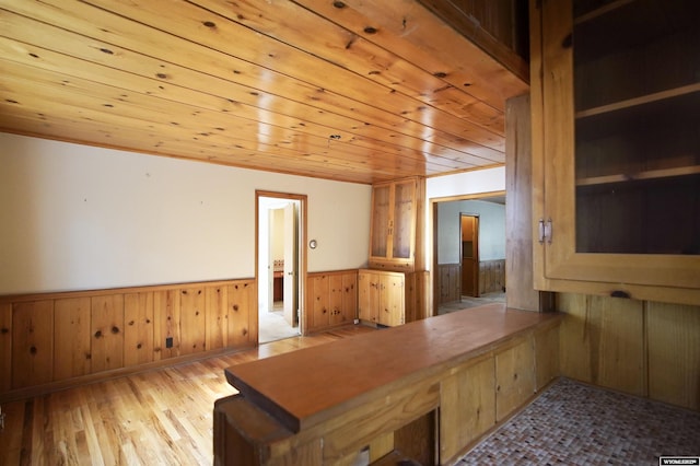 1339 S Mitchell St, Casper, WY 82601 - office area featuring a wainscoted wall, wood ceiling, light wood finished floors, and wooden walls