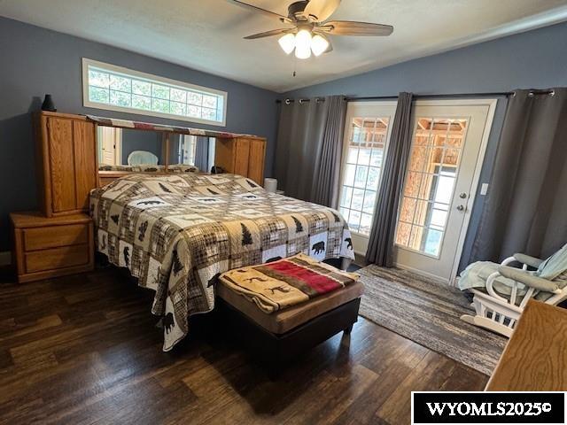309 Susie Ave, Diamondville, WY 83116 - bedroom featuring vaulted ceiling, wood finished floors, access to outside, and a ceiling fan