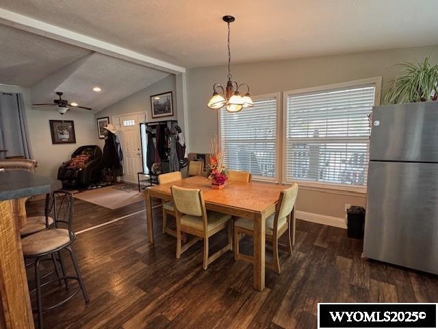 309 Susie Ave, Diamondville, WY 83116 - dining area with dark wood-type flooring, ceiling fan, and a chandelier