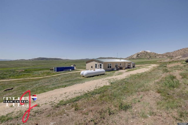 67 Monument Creek Rd, Hanna, WY 82327 - view of front of house with a mountain view and a view of countryside