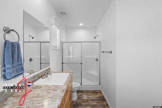 67 Monument Creek Rd, Hanna, WY 82327 - full bathroom featuring a shower stall, vanity, and wood finished floors