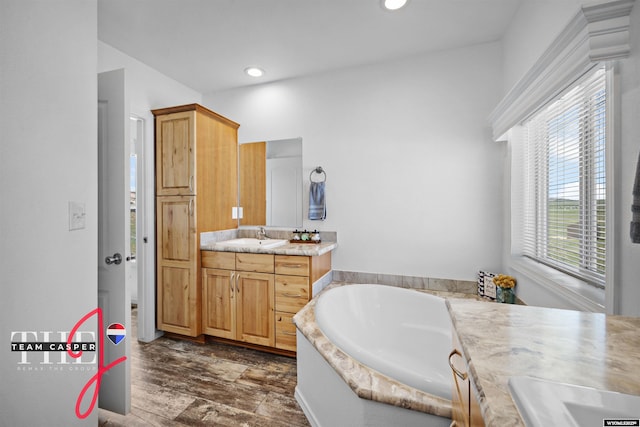 67 Monument Creek Rd, Hanna, WY 82327 - full bathroom featuring vanity, a garden tub, and recessed lighting