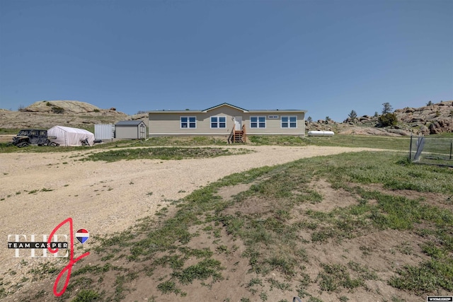 67 Monument Creek Rd, Hanna, WY 82327 - view of front facade featuring a shed