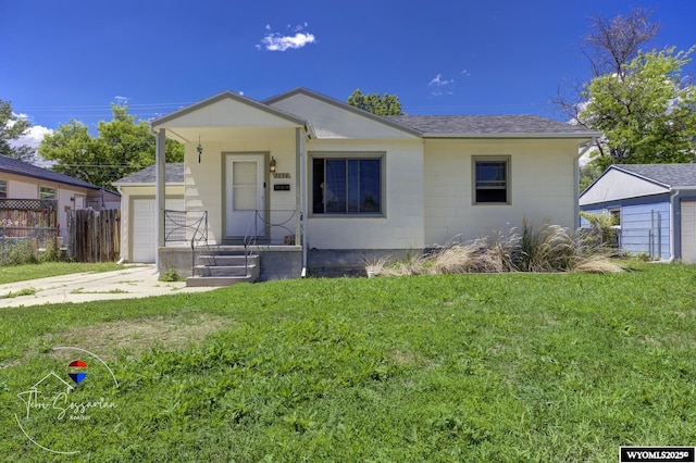 2634 Hanway Ave, Casper, WY 82604 - view of front of house with a shingled roof and a garage