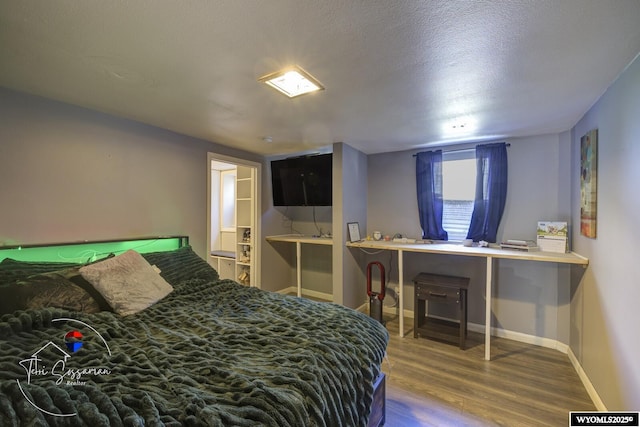 2634 Hanway Ave, Casper, WY 82604 - bedroom featuring wood finished floors and a textured ceiling