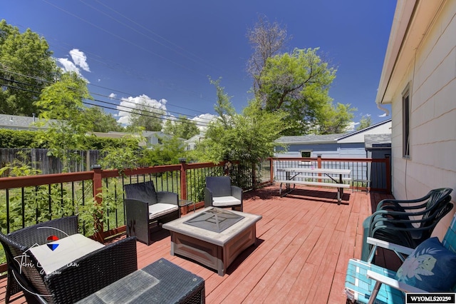 2634 Hanway Ave, Casper, WY 82604 - wooden terrace with an outdoor living space with a fire pit