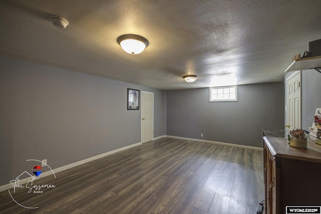 2634 Hanway Ave, Casper, WY 82604 - below grade area featuring a textured ceiling and dark wood-style flooring