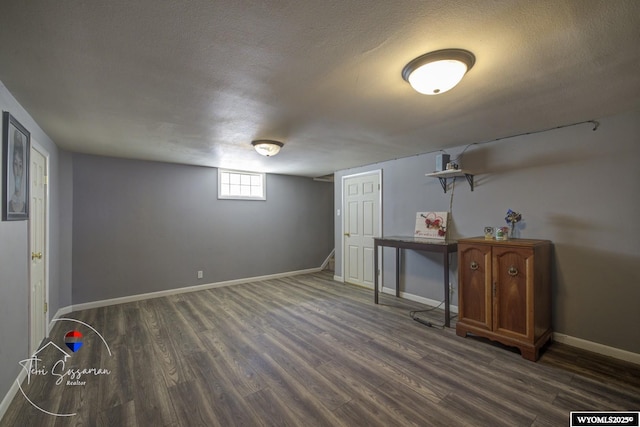 2634 Hanway Ave, Casper, WY 82604 - below grade area with dark wood-style flooring and a textured ceiling