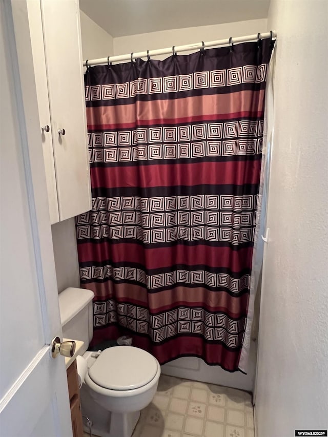 2617 E B St, Torrington, WY 82240 - full bath featuring tile patterned floors, vanity, and a shower with shower curtain