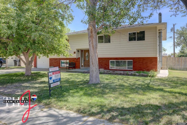 65 Calypso St, Casper, WY 82604 - split foyer home with brick siding and driveway