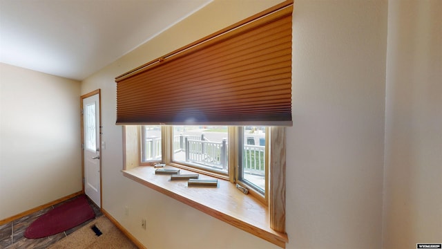 418 Spire Dr, Riverton, WY 82501 - entryway featuring baseboards and carpet