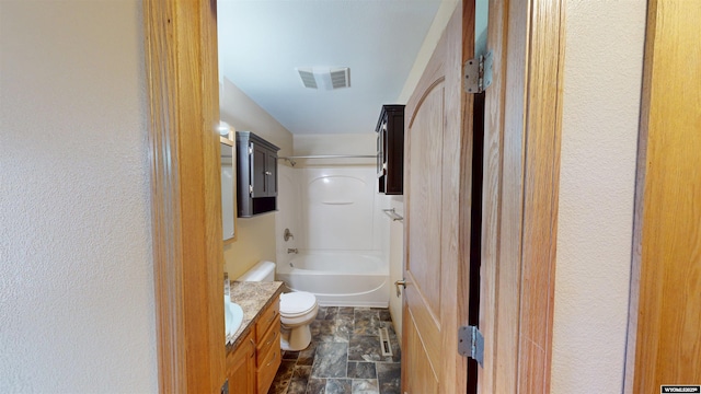 418 Spire Dr, Riverton, WY 82501 - bathroom featuring vanity, stone finish floors, and bathing tub / shower combination