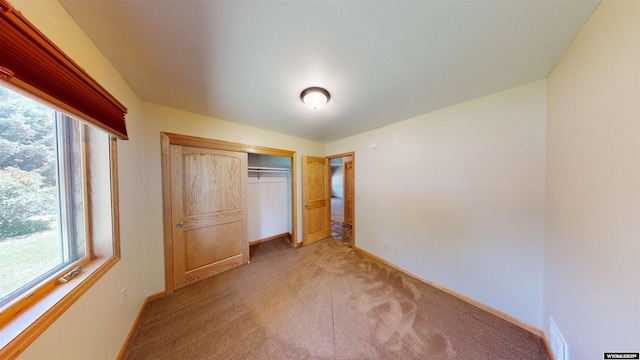 418 Spire Dr, Riverton, WY 82501 - unfurnished bedroom with light colored carpet and a closet