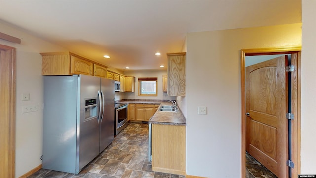 418 Spire Dr, Riverton, WY 82501 - kitchen with stainless steel appliances, light brown cabinets, recessed lighting, and stone finish flooring