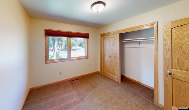 418 Spire Dr, Riverton, WY 82501 - unfurnished bedroom featuring light colored carpet and a closet