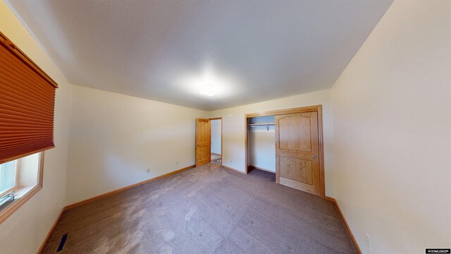 418 Spire Dr, Riverton, WY 82501 - unfurnished bedroom with light colored carpet and a closet
