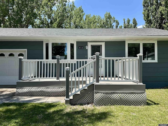 418 Spire Dr, Riverton, WY 82501 - view of exterior entry featuring a shingled roof and an attached garage