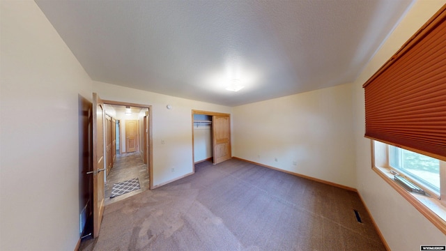 418 Spire Dr, Riverton, WY 82501 - unfurnished bedroom featuring light carpet and a closet