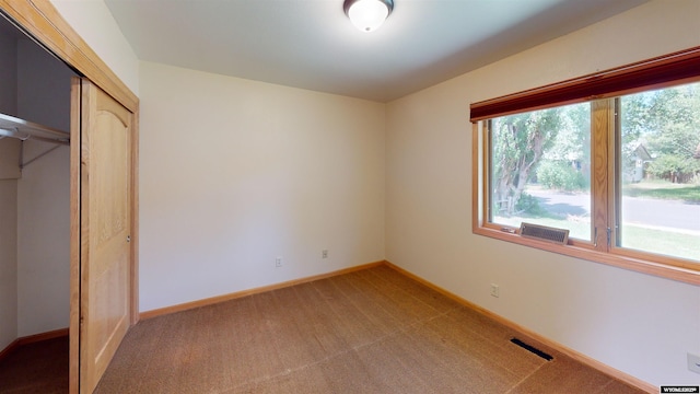 418 Spire Dr, Riverton, WY 82501 - unfurnished bedroom with light carpet and a closet