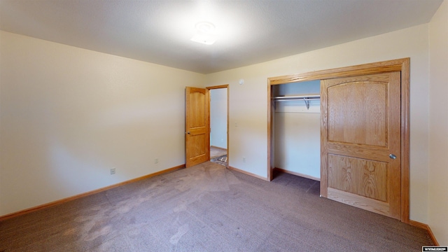 418 Spire Dr, Riverton, WY 82501 - unfurnished bedroom featuring carpet floors and a closet