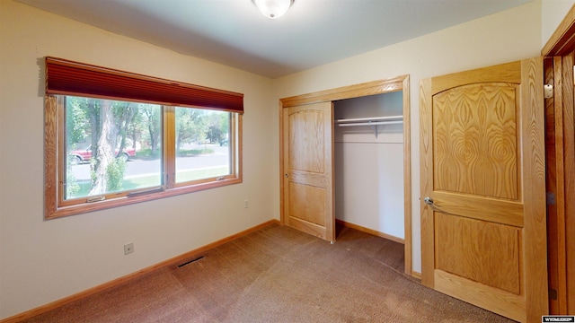 418 Spire Dr, Riverton, WY 82501 - unfurnished bedroom with carpet floors and a closet