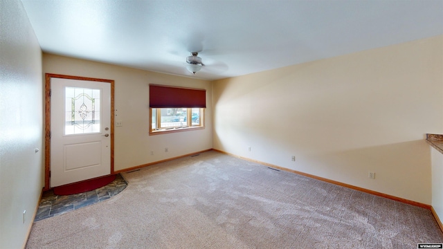 418 Spire Dr, Riverton, WY 82501 - foyer entrance with carpet flooring and baseboards