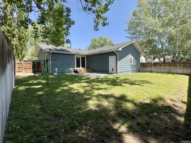 418 Spire Dr, Riverton, WY 82501 - rear view of property featuring entry steps and a fenced backyard