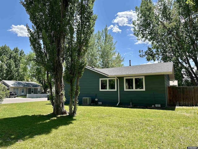 418 Spire Dr, Riverton, WY 82501 - view of home's exterior with a central AC unit and a shingled roof