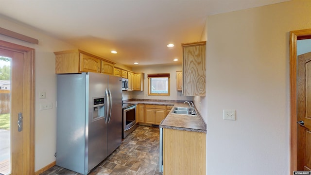 418 Spire Dr, Riverton, WY 82501 - kitchen with stainless steel appliances, light brown cabinets, recessed lighting, and stone finish flooring