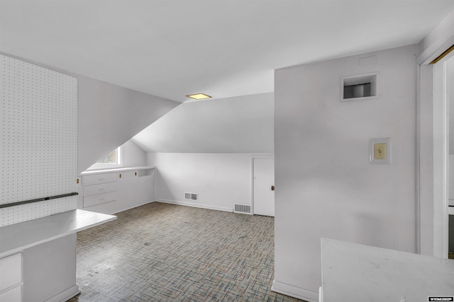 922 New Hampshire St, Rock Springs, WY 82901 - additional living space featuring vaulted ceiling and carpet flooring