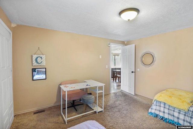 301 Cottonwood St, Evanston, WY 82930 - bedroom featuring carpet and baseboards